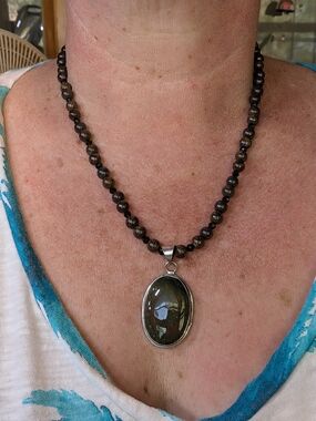 Handcrafted Dark Brown Beaded Necklace with Oval Green-Brown Pendant